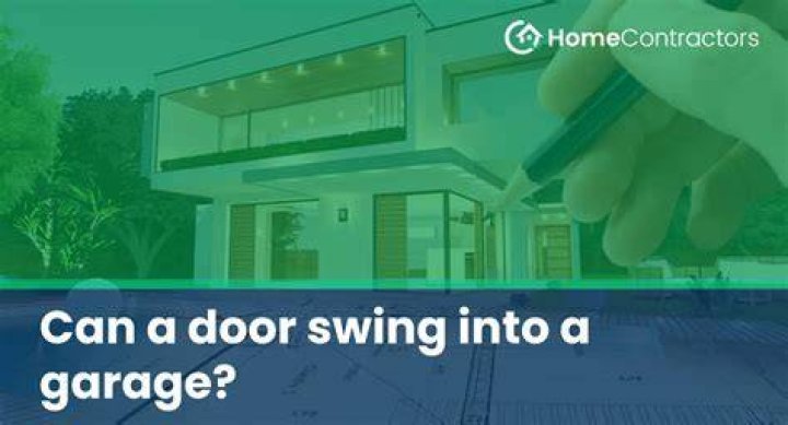 Can a door swing into a garage?