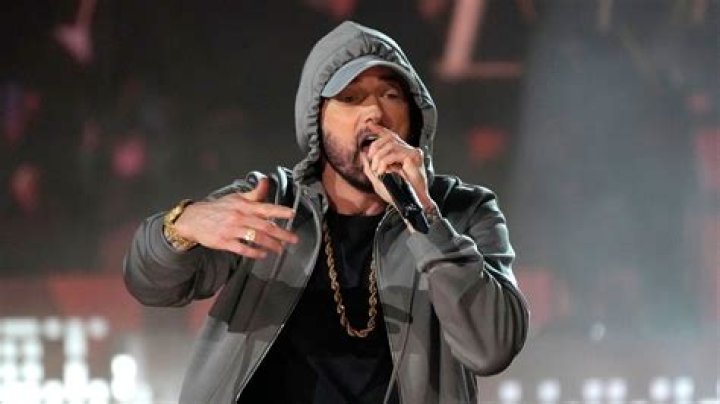 What songs did Eminem release in 2013?